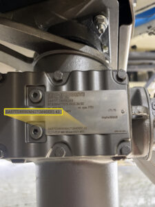 Close-up of a SEW gearmotor nameplate after Apex Industrial Automation added a custom part number for DS Containers